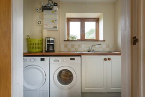 Utility room with washing machine and dryer
